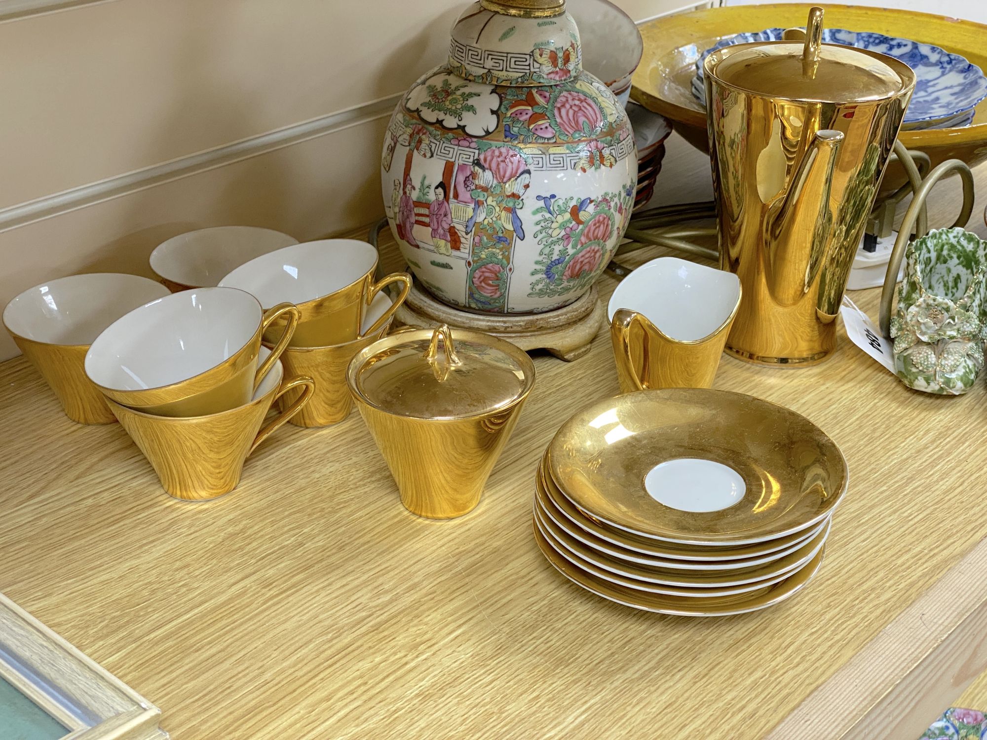 A Chinese famille rose lamp, a German gilt coffee set and sundries